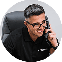 Matt taking a call at his desk at Chrome Telecom