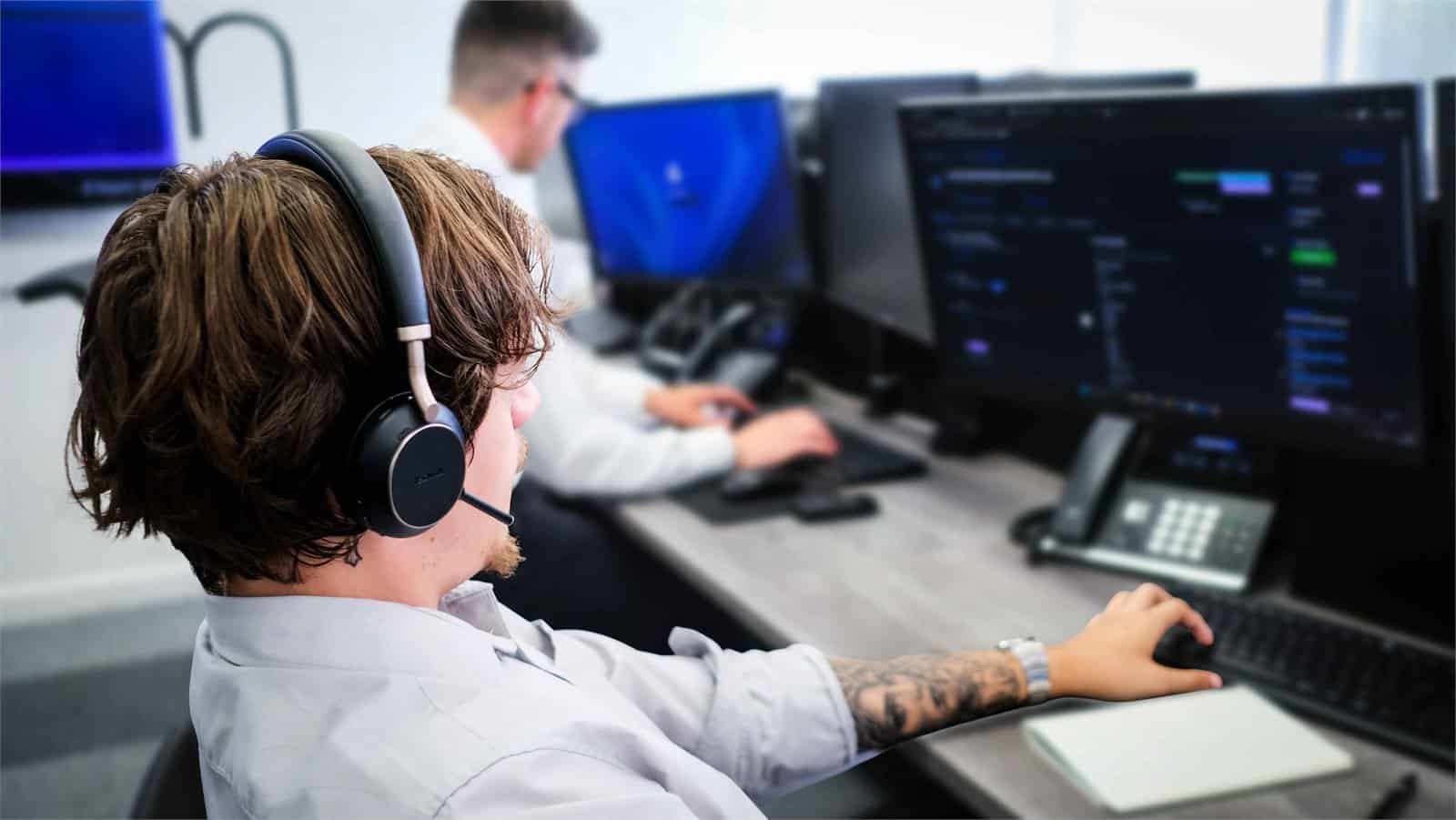 Harry and Matt working together at a computer