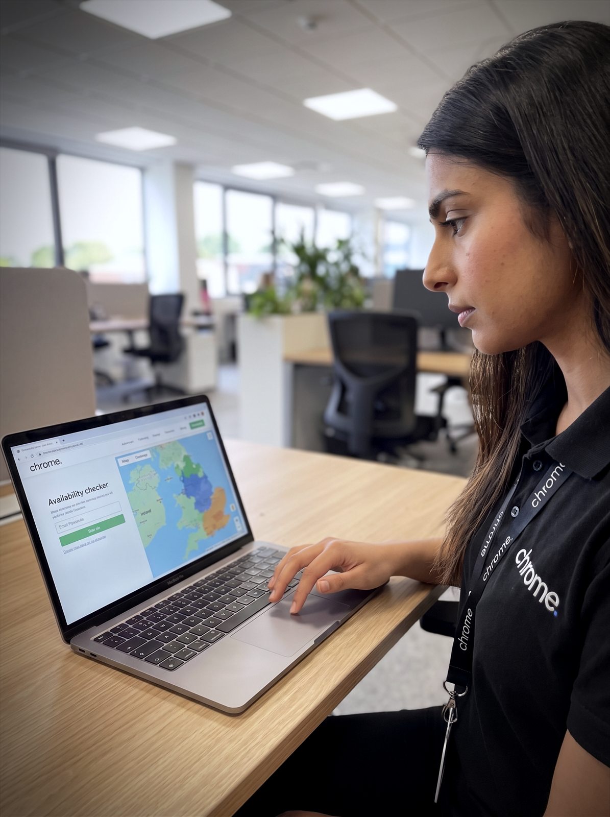 A Chrome Telecom colleague enters a postcode into a fibre availability checker with a coverage map on screen