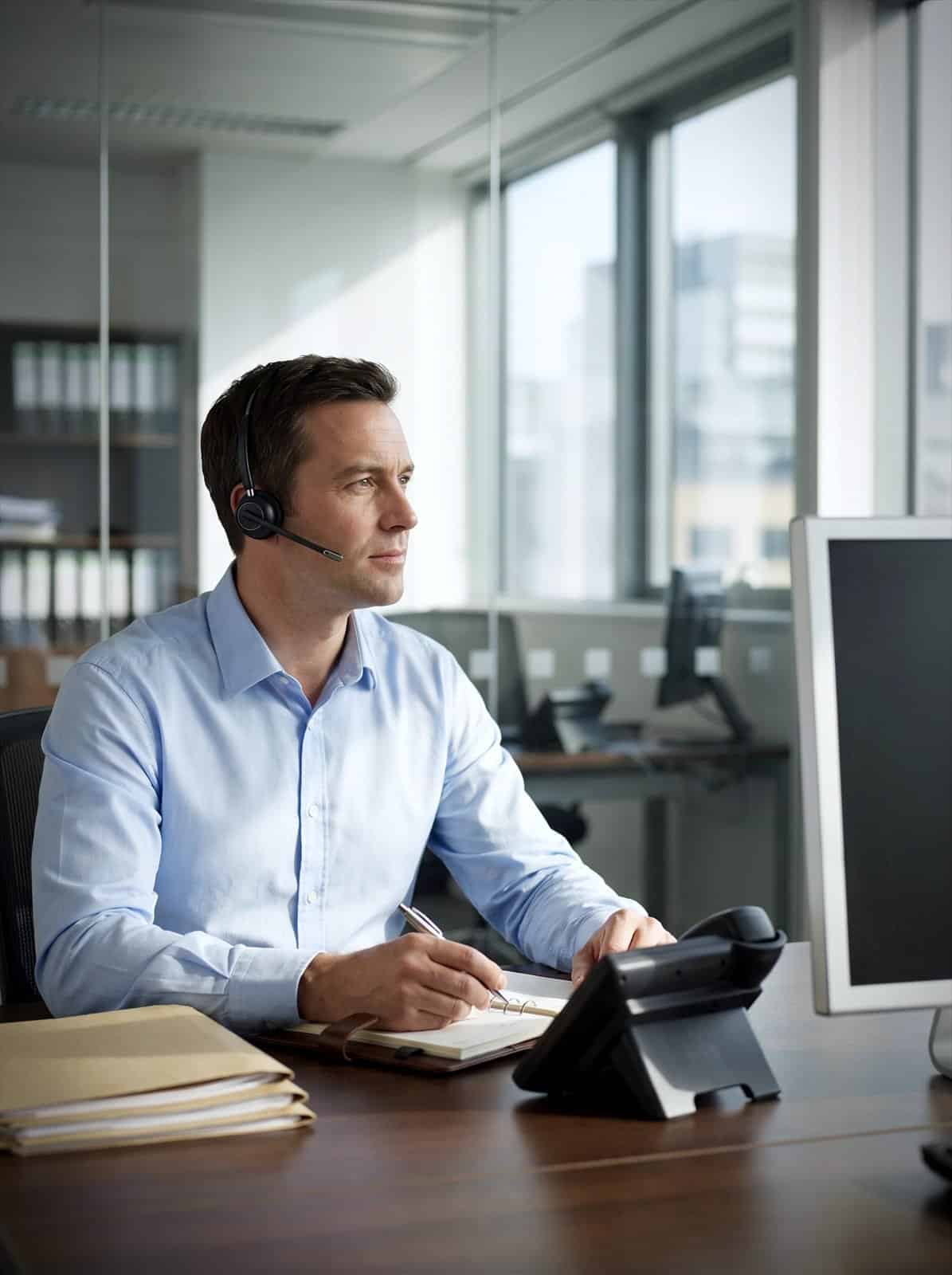 A client manager takes a client call at a professional services firm