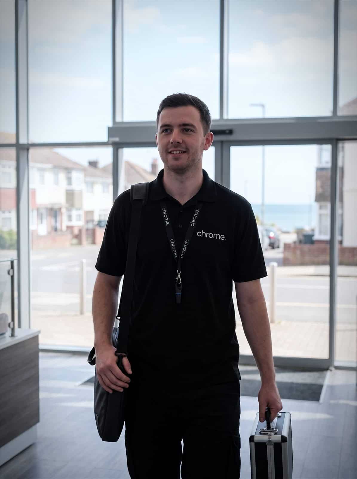 A Chrome Telecom engineer arriving at a business park reception on the south coast