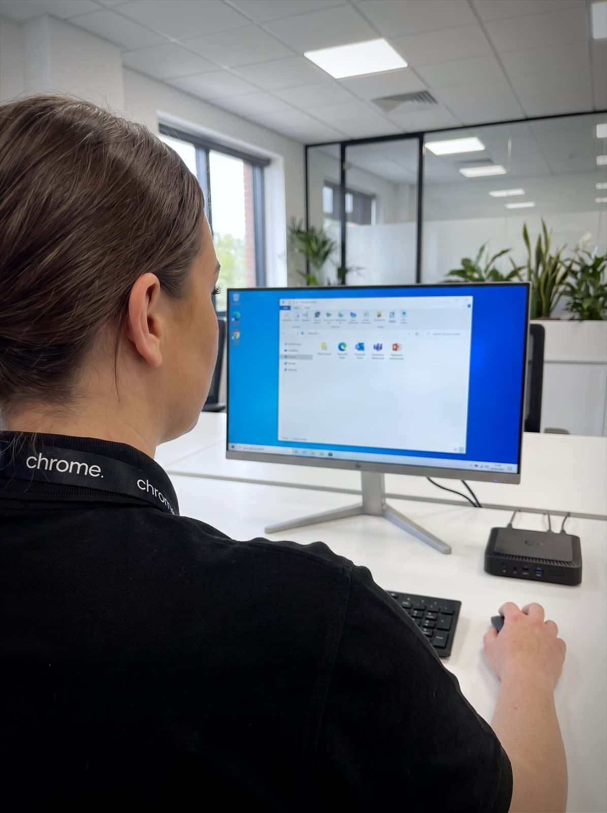 A Chrome Telecom colleague works in a hosted virtual desktop session from a thin client