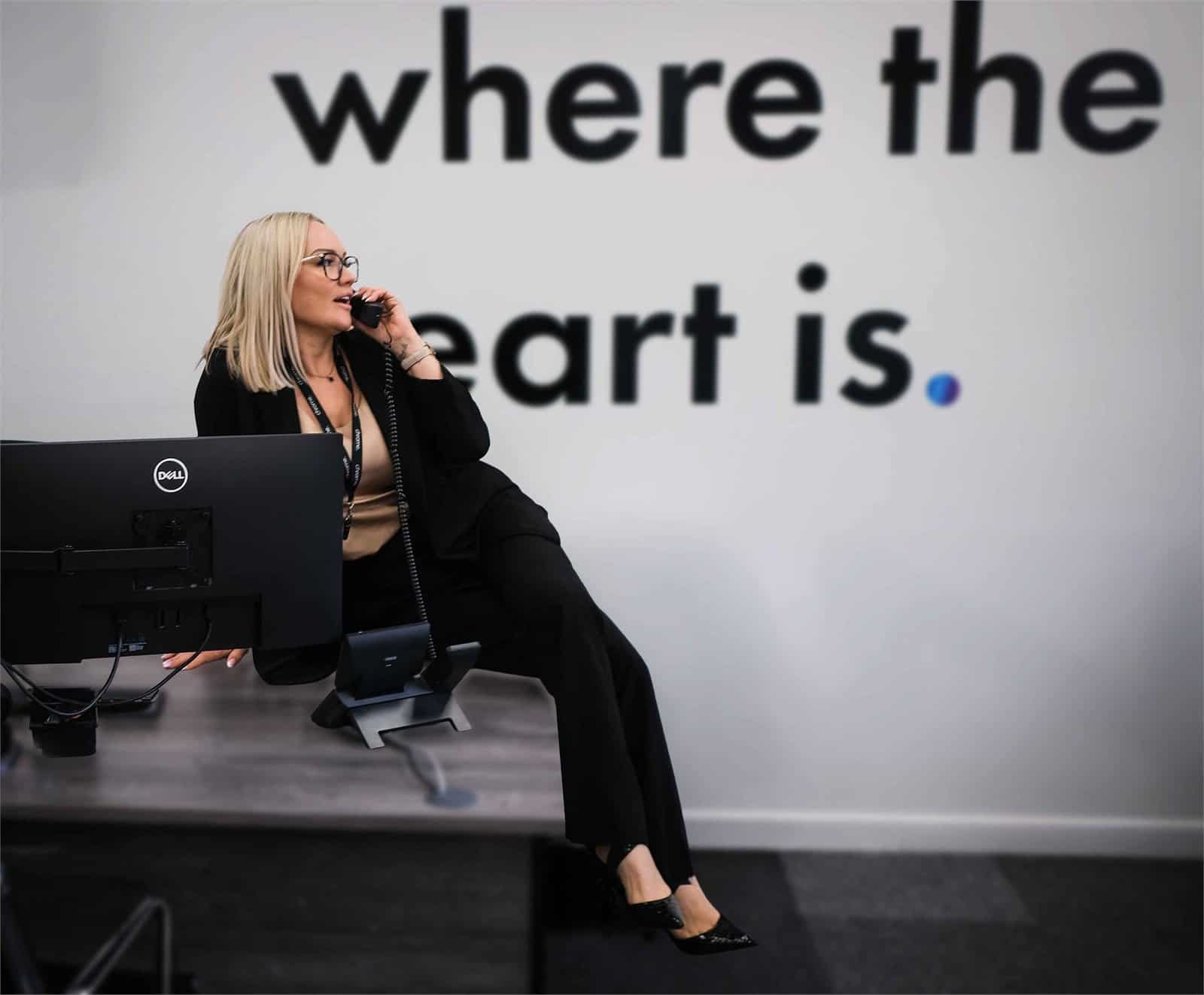 Kelly in the Chrome Telecom office, supporting customer reviews