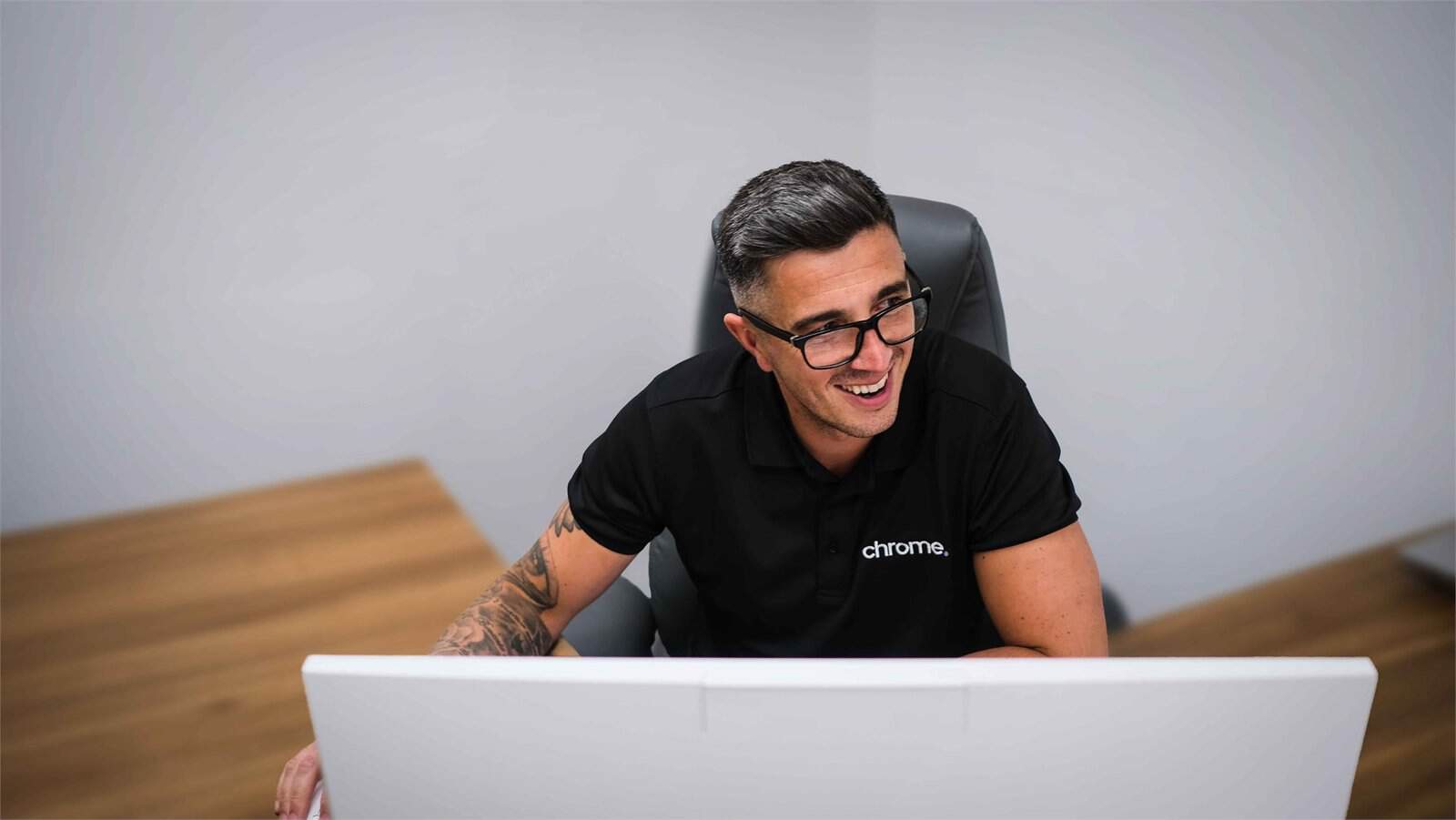 Matt working at his computer, supporting cyber security