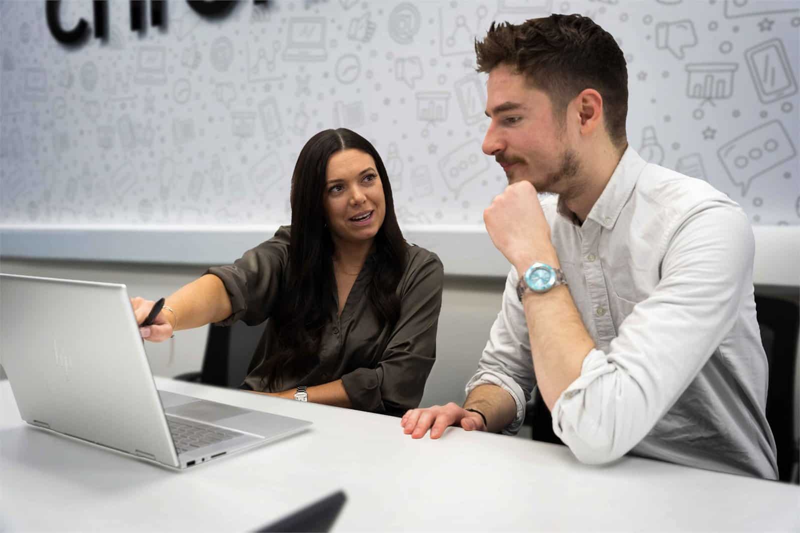 Rachel working with a colleague in the Chrome Telecom office