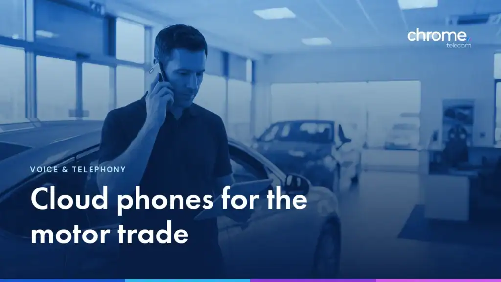 A dealership advisor on the phone beside a car in a showroom, with the headline Cloud phones for the motor trade