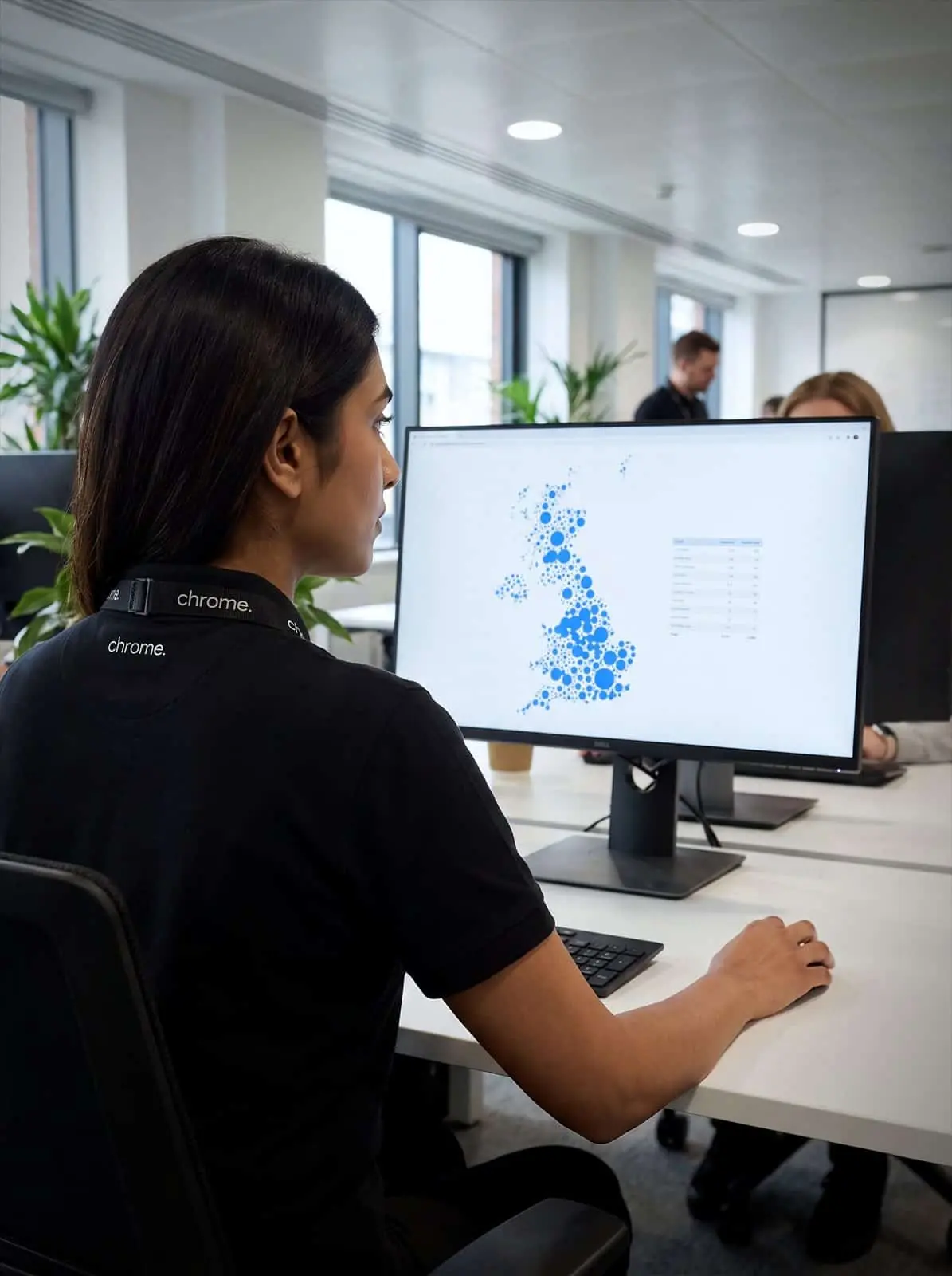 Chrome Telecom team member reviewing the Switch-off Britain full-fibre map on a monitor in the Chrome office