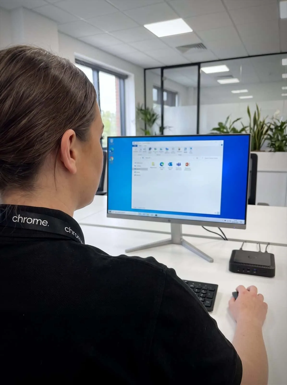 A Chrome Telecom colleague works in a hosted virtual desktop session from a thin client